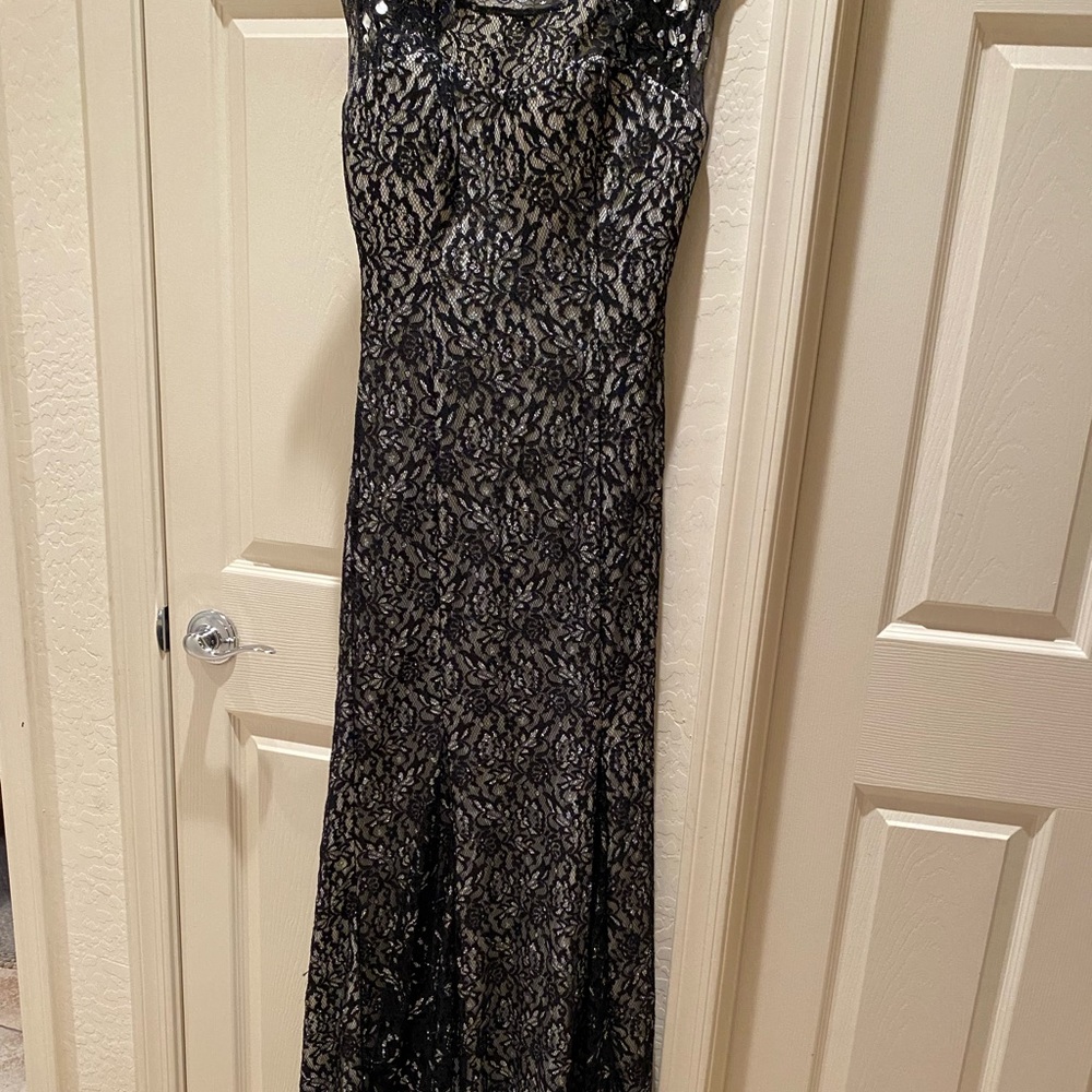 Black lace nude dress with diamond accents and a train